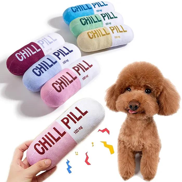 Jouet interactif en forme de pilule en peluche pour chien avec couineur