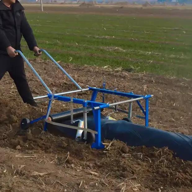 Machine de paillage agricole multifonctionnelle à traction manuelle pour la pose de film plastique