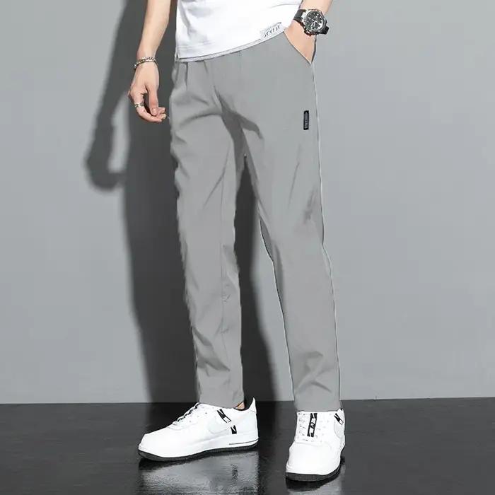Pantalons pour hommes en soie glacée 2025 été nouveau noir gris mince pantalons décontractés d'affai