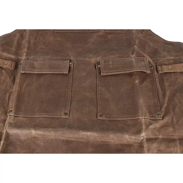 Tablier de protection en toile cireuse pour bijoutiers avec 4 poches pour outils et bretelles rembourrées marine pour sécurité et confort professionnel