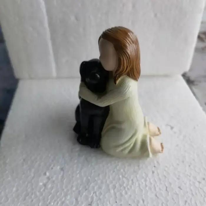 Statue d'ange et de chien mignon de créativité de dessin animé