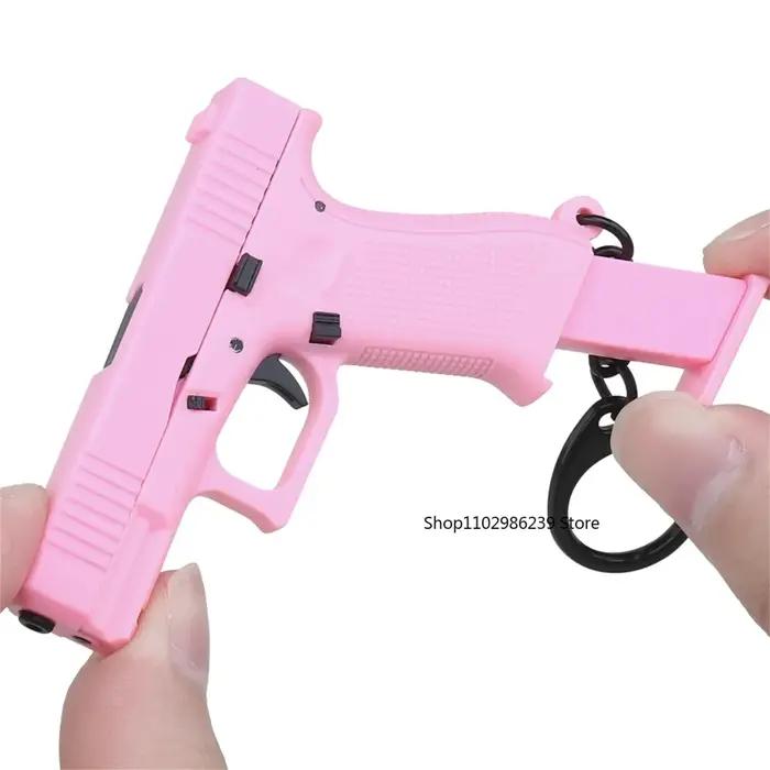 Mini Pistolet G45 Porte-clés Tactique - Modèle Réaliste Clé Charm avec Chargeur Amovible Cadeau Anniversaire
