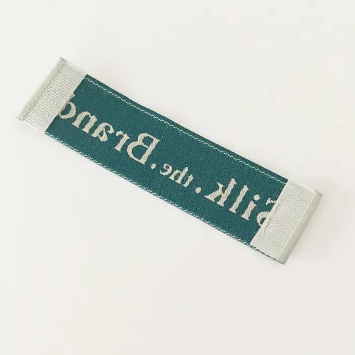 Logo personnalisé couture vêtements chemises sacs étiquette tissée conception gratuite