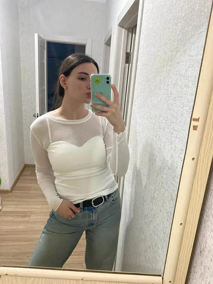Haute qualité plaine T-shirt femmes coton élastique basique T-shirts femme décontracté hauts à manches longues Sexy mince T-shirt voir à travers