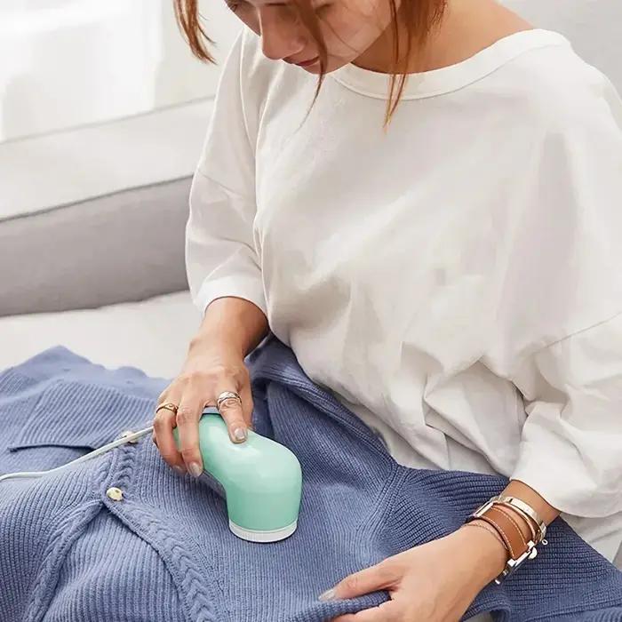 Limuove la peluches des vêtements électriques. Épilateur pour animaux de compagnie