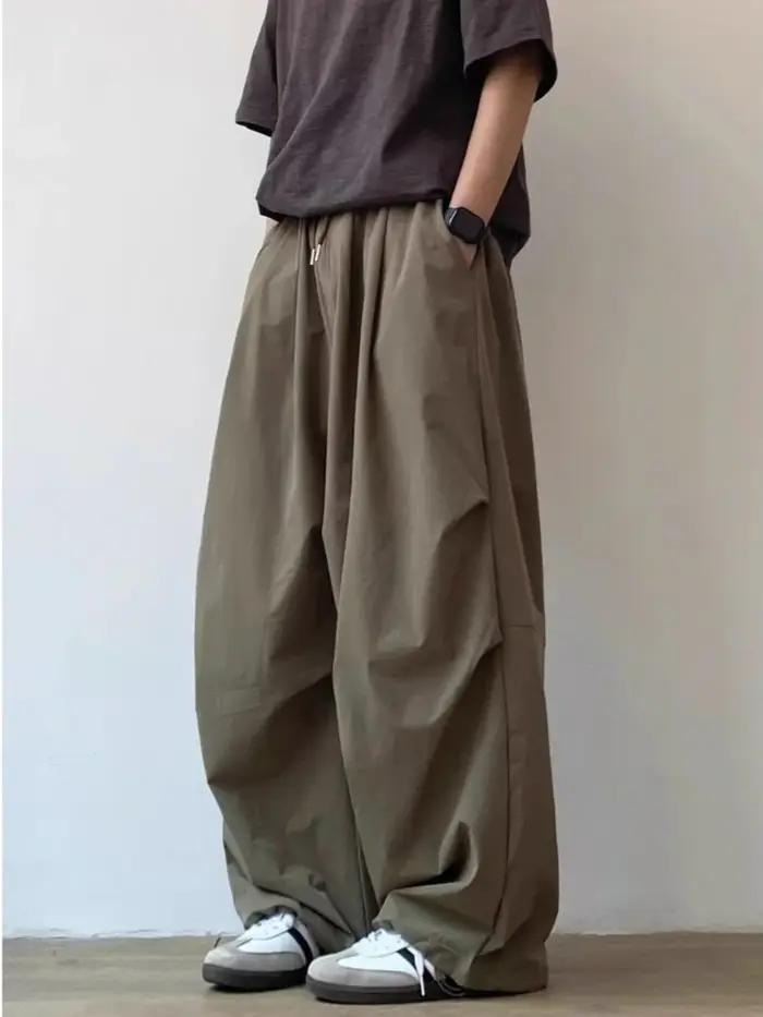 Pantalon décontracté unisexe plissé ample taille élastique coupe droite couleur unie style vintage japonais pour l'été