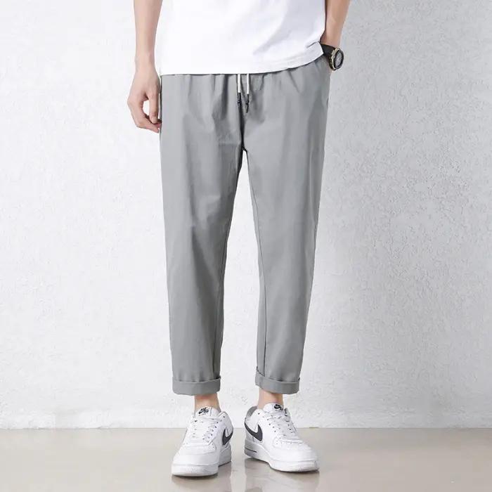 Pantalon décontracté pour homme en coton respirant, couleur unie gris kaki, idéal pour le printemps